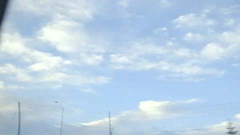 View of the Morning Sky while Driving Stock Footage 147690777