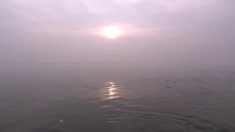 View of morning sun over Ganges River in Varanasi, India, as seen from boat Stock Footage 86760540