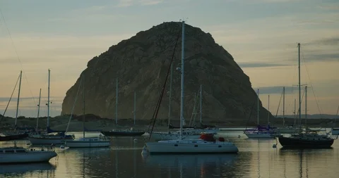 View of Morro Rock during sunset at Morro Bay, California Stock Footage 99146629
