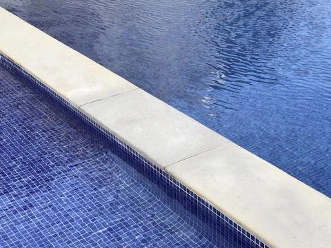 View of the mosaics and the depth separation stone of a swimming pool Foto stock