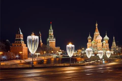 View from Moskvoretsky bridge to the Kremlin and Pokrovsky Cathedral Stock Photos