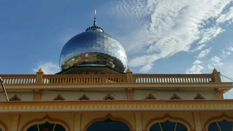 View of the mosque's transitional dome during the day with a cloudy sky Stock Footage 270353800