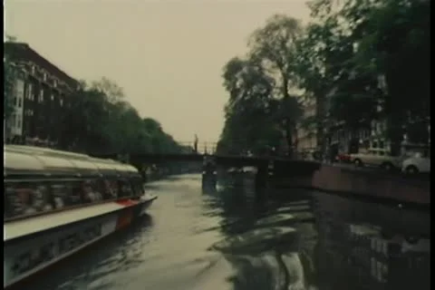 View from motorboat speeding down Amsterdam canal Stock Footage 11349374