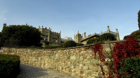View of Mount Ai-Petri at sunset from alley of lower park of Vorontsov Palace. Stock Footage 106857783