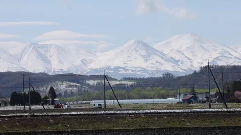 View of Mount Asahi and snow-capped peaks in Japan. Stock-Footage 343679027