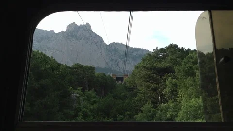 View of the mount Ay Petri and trees from the cable car . Crimea Stock Footage 82299041