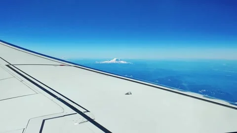 View of Mount Baker glacier-covered stratovolcano from an airplane window Stock Footage 324496876