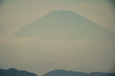 View of Mount Fuji during sunset with warm colors and soft sky tones Stock Footage 321783243