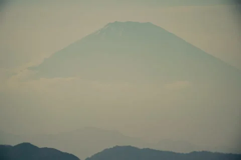 View of Mount Fuji during sunset with warm colors and soft sky tones Stock Footage 321783556