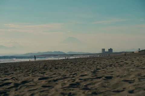 View of Mount Fuji during sunset with warm colors and soft sky tones Stock Footage 321792450