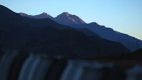 View of Mount Kazbek from a mountain settlement for tourists at the foothill. Stock Footage 248530175