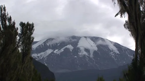 View of the mount Kilimanjaro covered by clouds. Tanzania Stock Footage 56343050