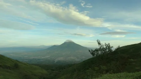 The view of Mount Sindoro covered in lenticular clouds, with cityscape and skies Stock Footage 152754958