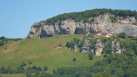 View on mountain and forest in summer sunny day. Panorama. Big vertical rocks Stock Footage 268592325