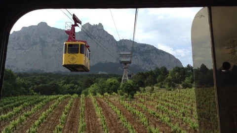 View of the mountain Ay Petri and vineyards from the cable car , Crimea , Russia Stock Footage 82299069