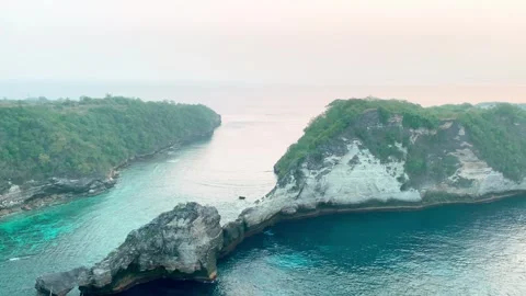 View of mountain cliff in ocean at Diamond beach, Nusa penida Stock Footage 295324847