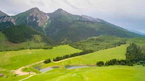 View of Mountain Forest Covered in Clouds Stock Photos