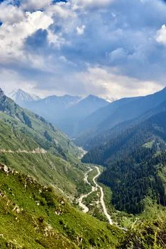 View of the mountain gorge with dramatic cloudy sky Stock Photos