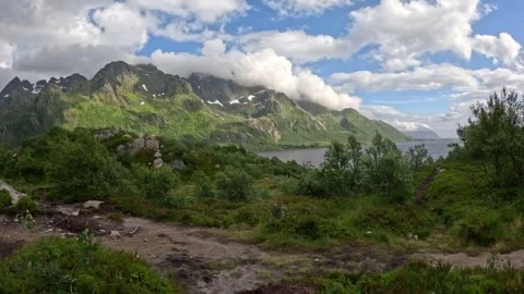 View from mountain hiking trail towards fjord and dramatic peaks in Norway Stock-Footage 343833615