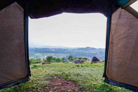 View of the mountain from inside a camping tent Stock Photos