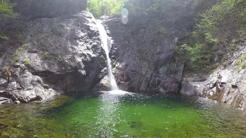 View of a mountain lake and a small waterfall in the Seoraksan National Park Stock Footage 92536018