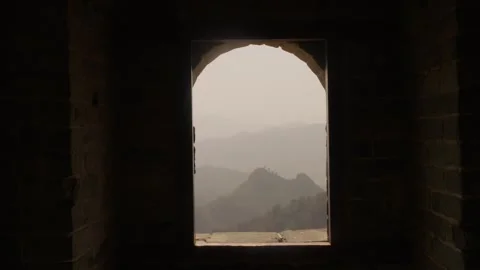 View of Mountain Landscape Through Stone Window at Great Wall Jinshanling Stock Footage 345678490