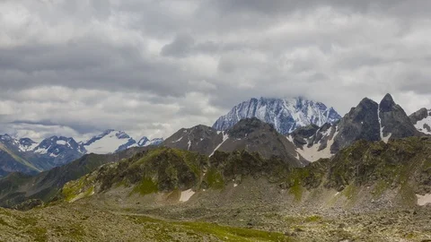 View from a mountain pass under a dark cloudy sky, 4K time lapse scene Stock Footage 117240966