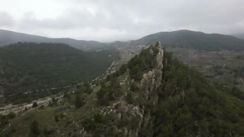 View of a mountain peak and valley Stock Footage 239942060