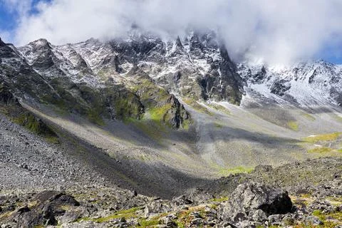 View of mountain peak covered with clouds Stock Photos