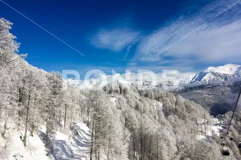 A view of the mountain peaks covered with snow in the ski resort of Rosa Kh.. Stock Photos