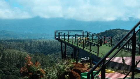 A view of a mountain range with a bridge and a railing. Malino indonesia Stock Photos