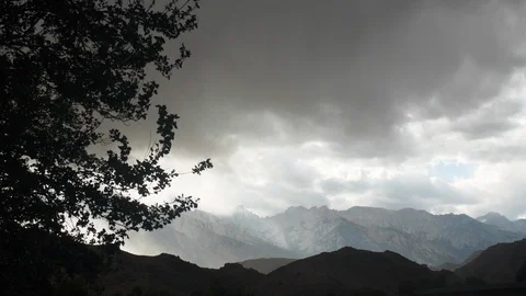 View on mountain range in cloudy weather, Lake Tahoe, Sierra Nevada, US Stock Footage 137945438