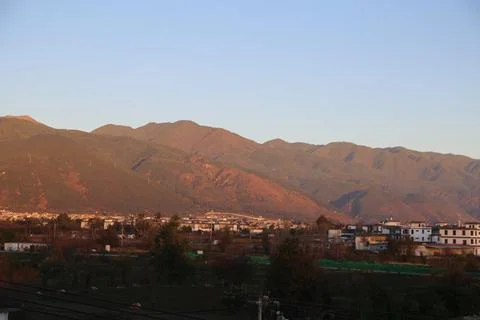 The view of the mountain range from dali city, with mountains in front and .. Stock Photos