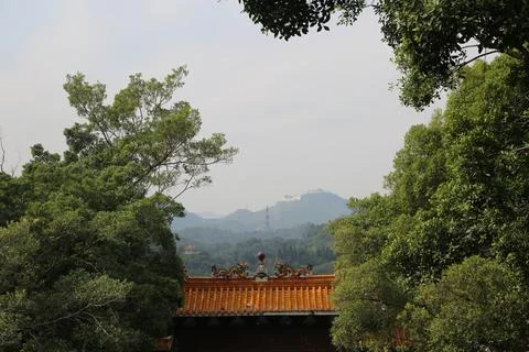 A view of a mountain range with a house in the background Stock Photos