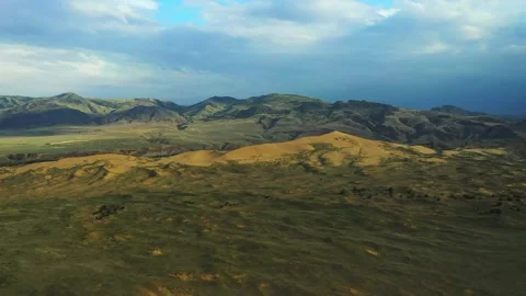 View of a mountain range from a plane window with a view of the mountains Stock Footage 243872993