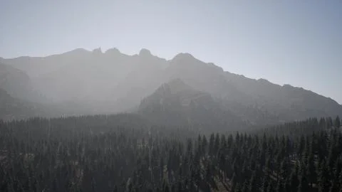 A view of a mountain range with trees in the foreground Stock Illustration