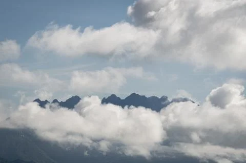 View of the mountain range of the Venetian prealps covered with thick clouds Stock Photos