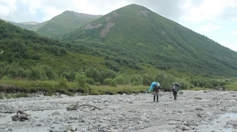 View of mountain river in Georgia with walking tourists Stock Footage 41493387