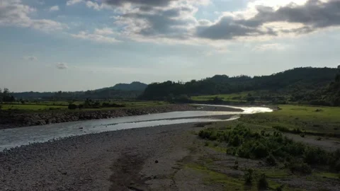 View of the mountain river in the gorge, the sun is displayed in the river Stock Footage 151159299