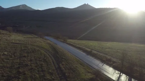 View of a mountain road at sunset Stock Footage 84545982