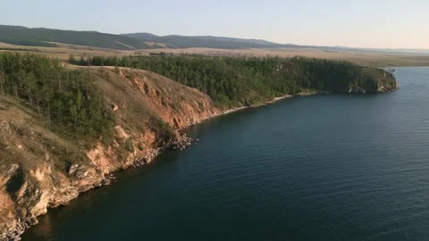 View of mountain rocks and blue clear water of the small sea of Lake Baikal Stock Footage 278442716