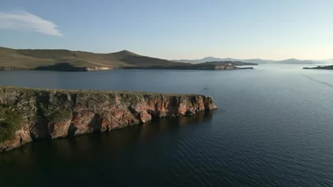View of mountain rocks and blue clear water of the small sea of Lake Baikal Stock Footage 278442965