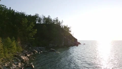 View of mountain rocks and blue clear water of the small sea of Lake Baikal Stock Footage 278443117