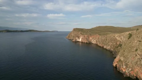 View of mountain rocks and blue clear water of the small sea of Lake Baikal Stock Footage 278443205