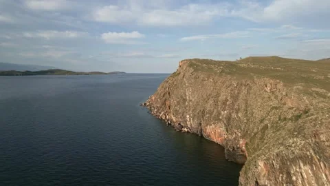 View of mountain rocks and blue clear water of the small sea of Lake Baikal Stock Footage 278443444