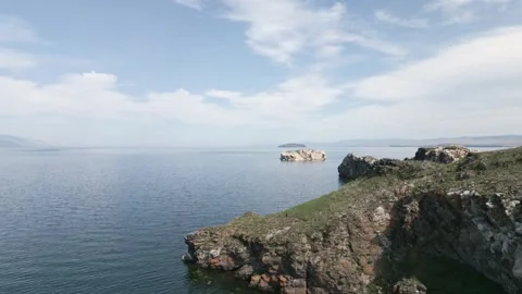 View of mountain rocks and blue clear water of the small sea of Lake Baikal Stock Footage 278443552