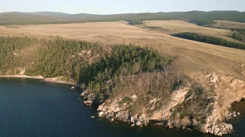 View of mountain rocks and blue clear water of the small sea of Lake Baikal Stock Footage 278443624