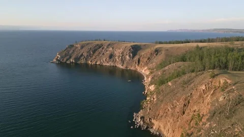 View of mountain rocks and blue clear water of the small sea of Lake Baikal Stock Footage 278443626