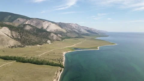 View of mountain rocks and blue clear water of the small sea of Lake Baikal Stock Footage 278443695