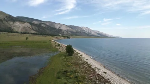 View of mountain rocks and blue clear water of the small sea of Lake Baikal Stock Footage 278443717
